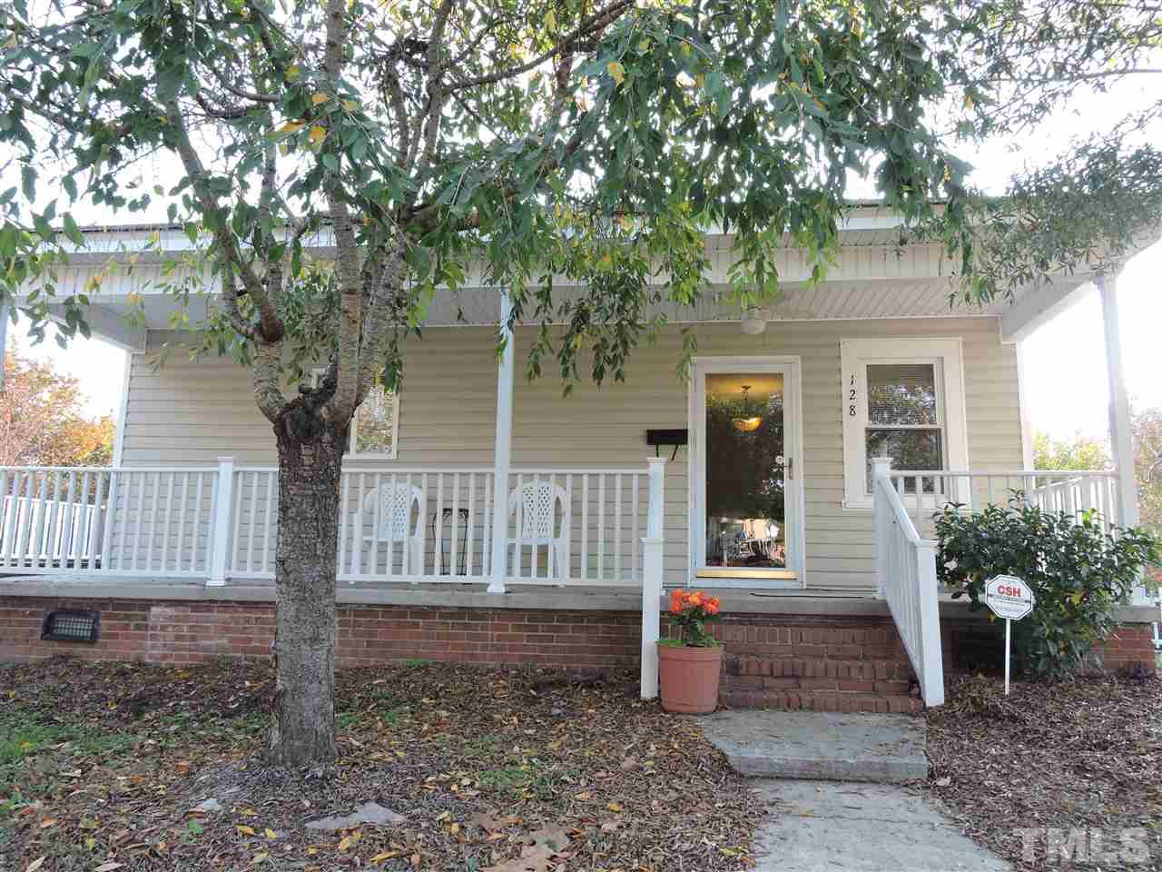 128 Allgood Street Roxboro, NC 27573 - Photo 12 of 17 a front view of a house with garden