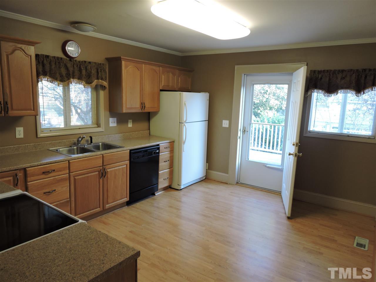 128 Allgood Street Roxboro, NC 27573 - Photo 13 of 17 a kitchen with a refrigerator and a sink
