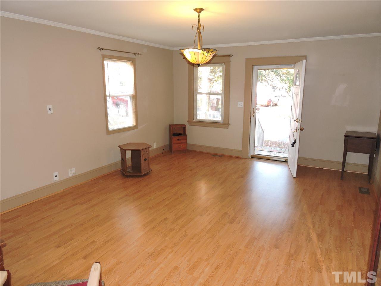 128 Allgood Street Roxboro, NC 27573 - Photo 4 of 17 a furnished livingroom with windows and wooden floor