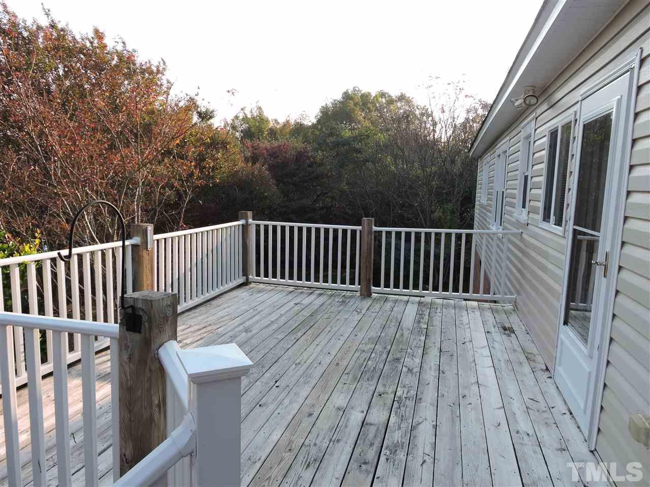 128 Allgood Street Roxboro, NC 27573 - Photo 8 of 17 a view of deck with wooden floor and fence