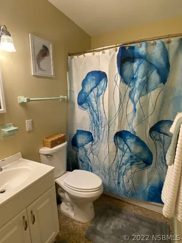 a bathroom with a toilet and a sink