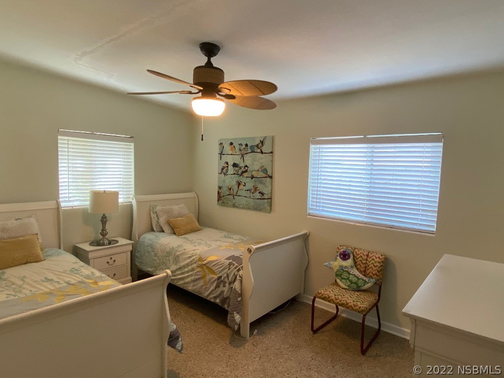 229 Robinson Road New Smyrna Beach, FL 32169 - Photo 14 of 23 a bedroom with a bed and a window
