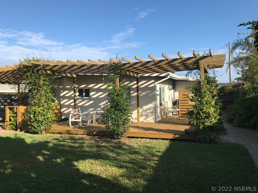 229 Robinson Road New Smyrna Beach, FL 32169 - Photo 22 of 23 a view of a house with a yard