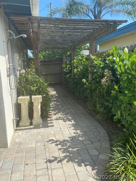 229 Robinson Road New Smyrna Beach, FL 32169 - Photo 23 of 23 a view of a pathway both side of house