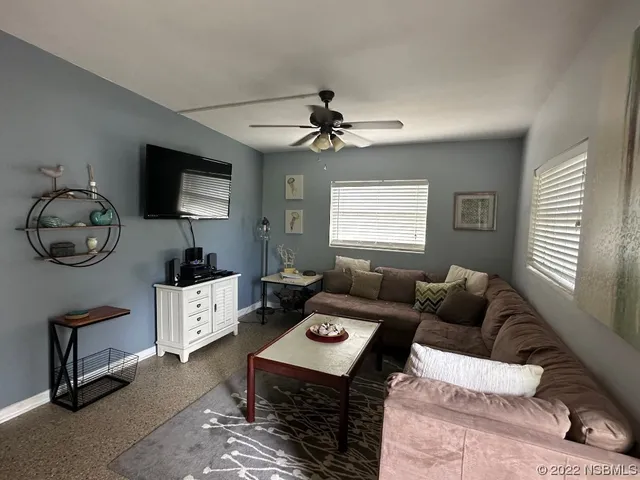 a living room with furniture and a window