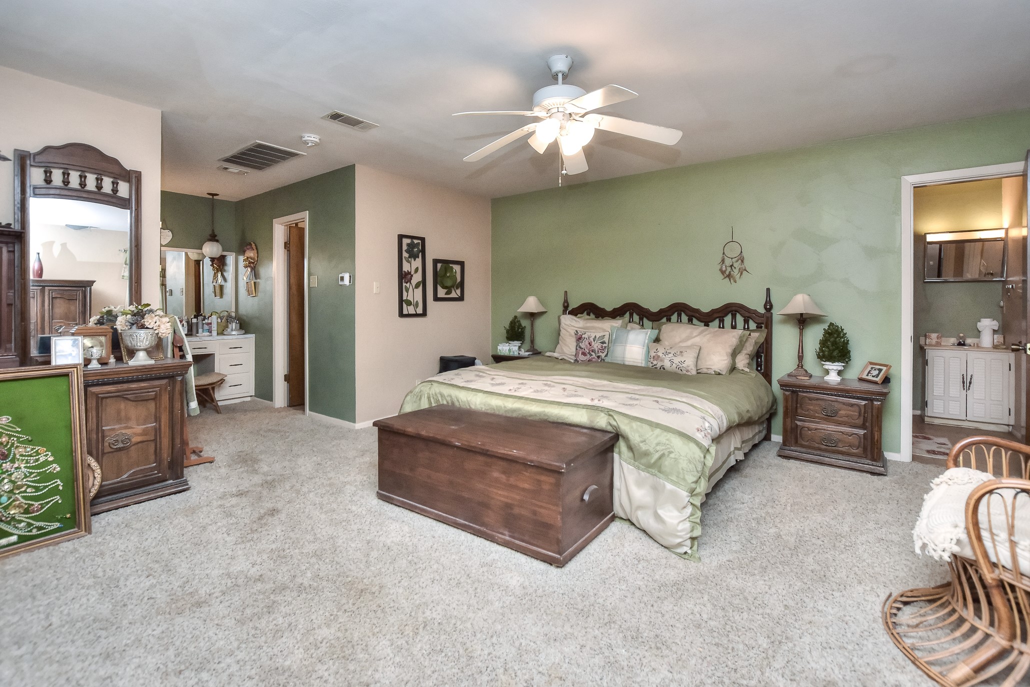 118 Oak Ridge Circle Georgetown, TX 78628 - Photo 17 of 38 a spacious bedroom with a bed and a chandelier