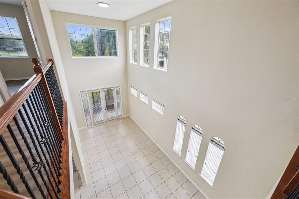551 Terrace Spring Drive Orlando, FL 32828 - Photo 24 of 41 a view of a hallway with windows