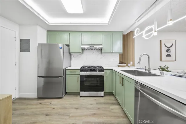 a kitchen with a stove and a refrigerator