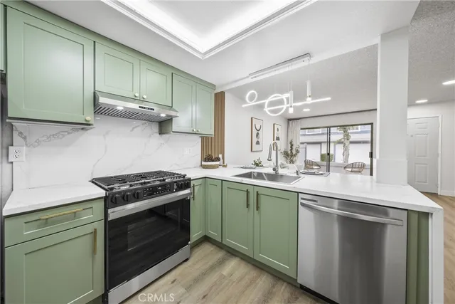 a kitchen with a stove and a sink