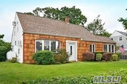 22 Ranch Lane Levittown, NY 11756 - Photo 1 of 1 a front view of house with yard and green space