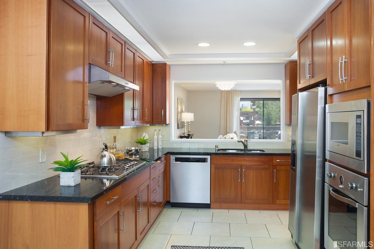 15 Lagoon Road Tiburon, CA 94920 - Photo 12 of 39 Undated kitchen, another perspective. Note the newer cabinets, counters, tile floor, stainless steel appliances and plantation shutters.