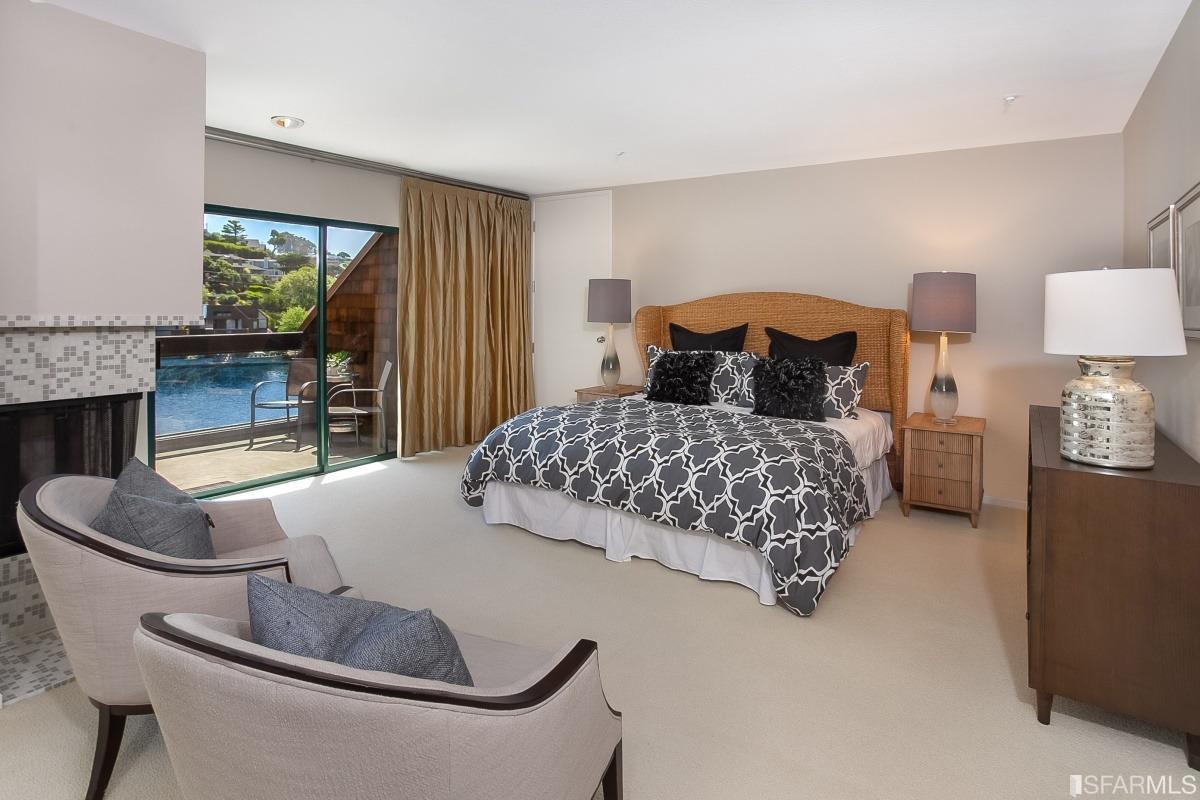 15 Lagoon Road Tiburon, CA 94920 - Photo 14 of 39 Master suite featuring tall ceilings, attached deck, fireplace and room to relax.
