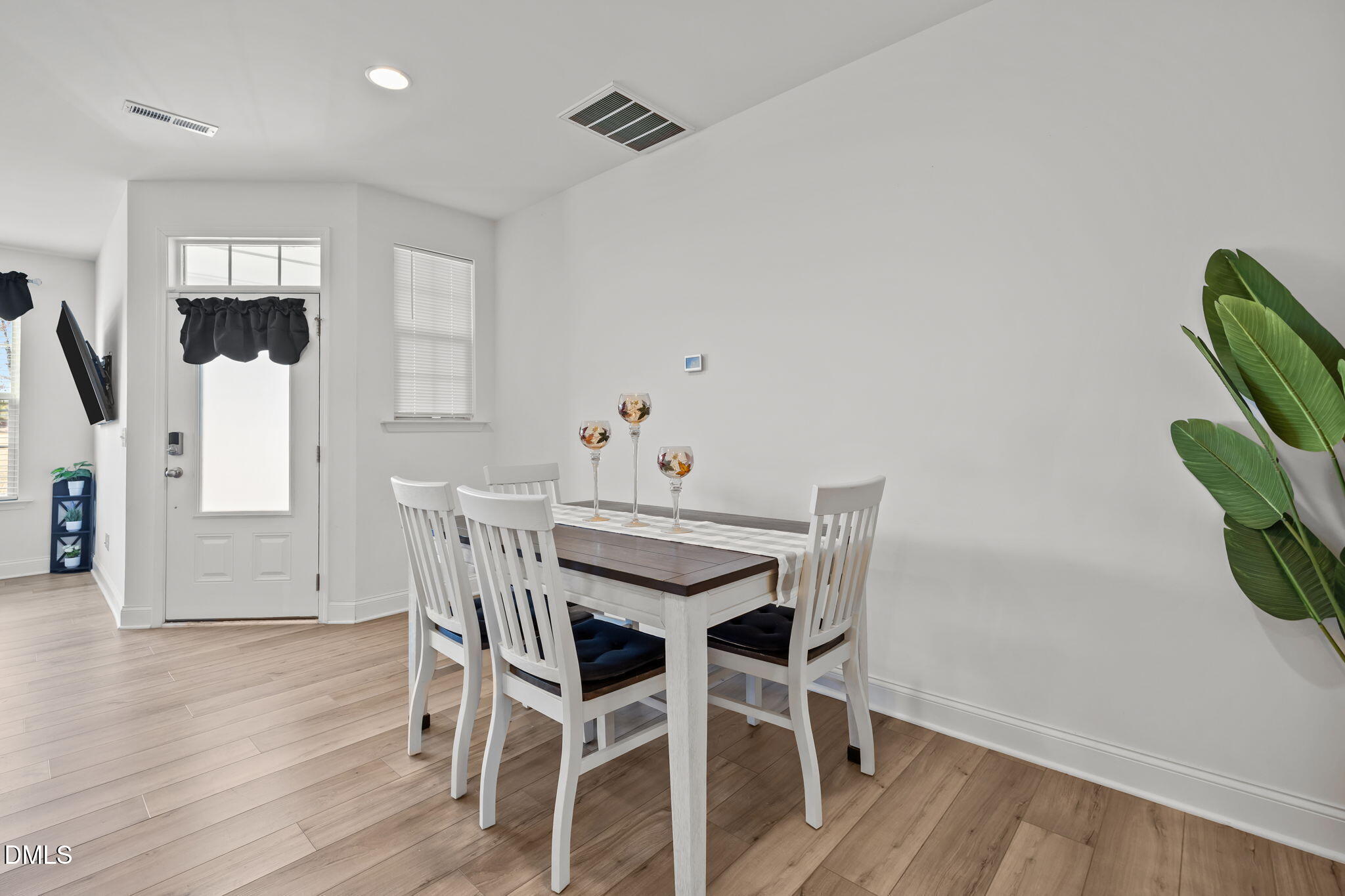 6173 Taylor Road Wendell, NC 27591 - Photo 8 of 31 a view of a dining room with furniture and wooden floor