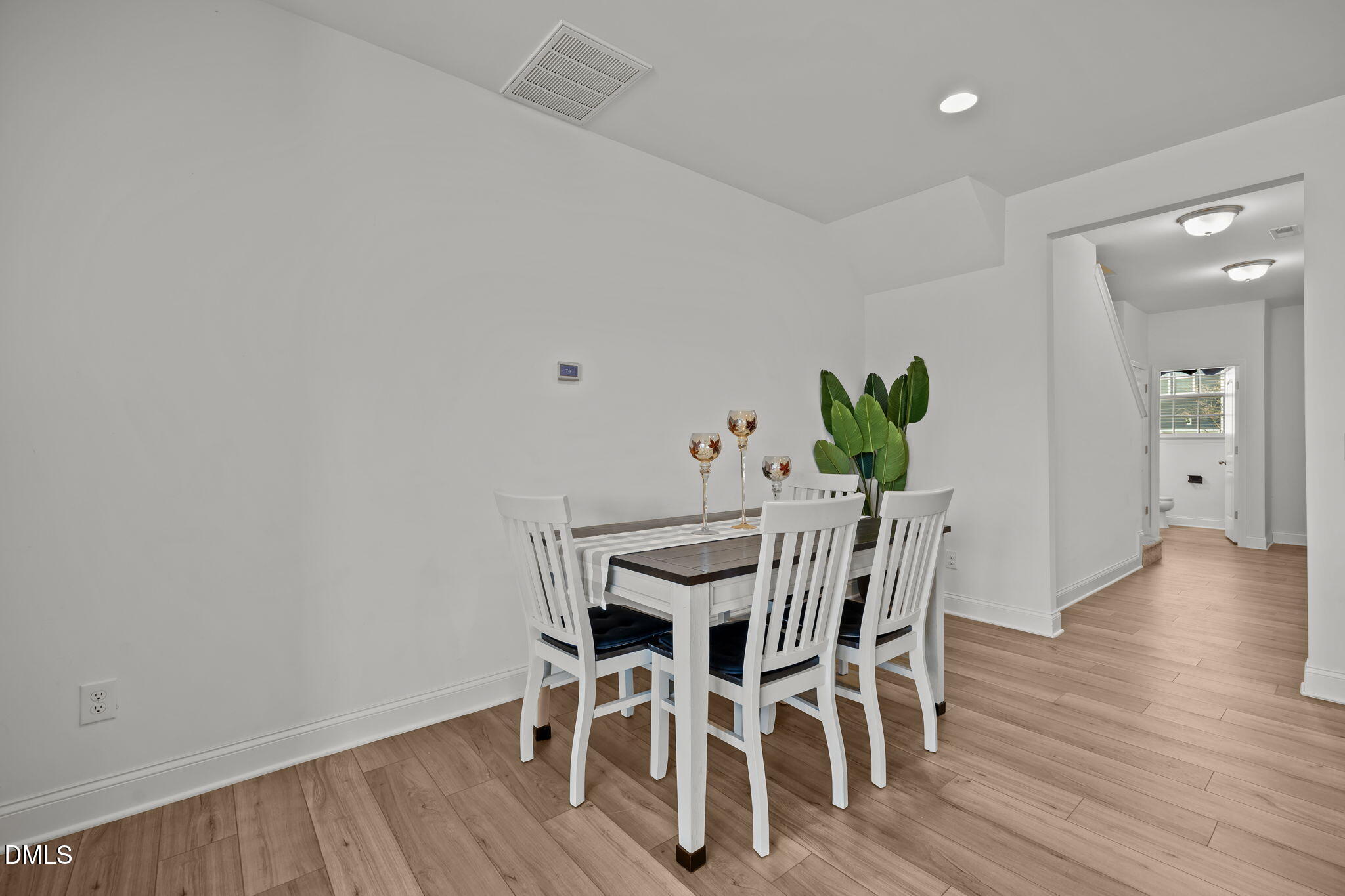 6173 Taylor Road Wendell, NC 27591 - Photo 9 of 31 a view of a dining room with furniture and wooden floor