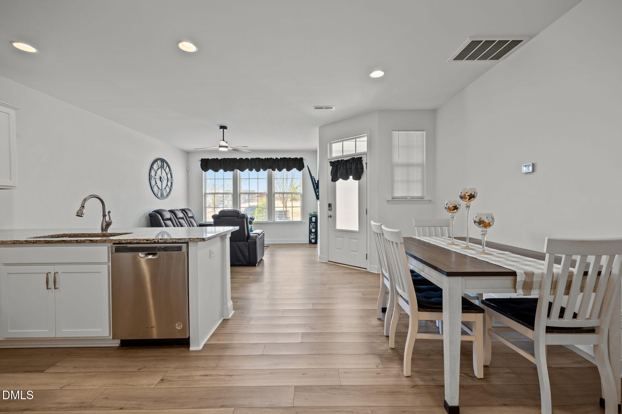 6173 Taylor Road Wendell, NC 27591 - Photo 11 of 31 a open kitchen with granite countertop a white stove top oven and cabinets
