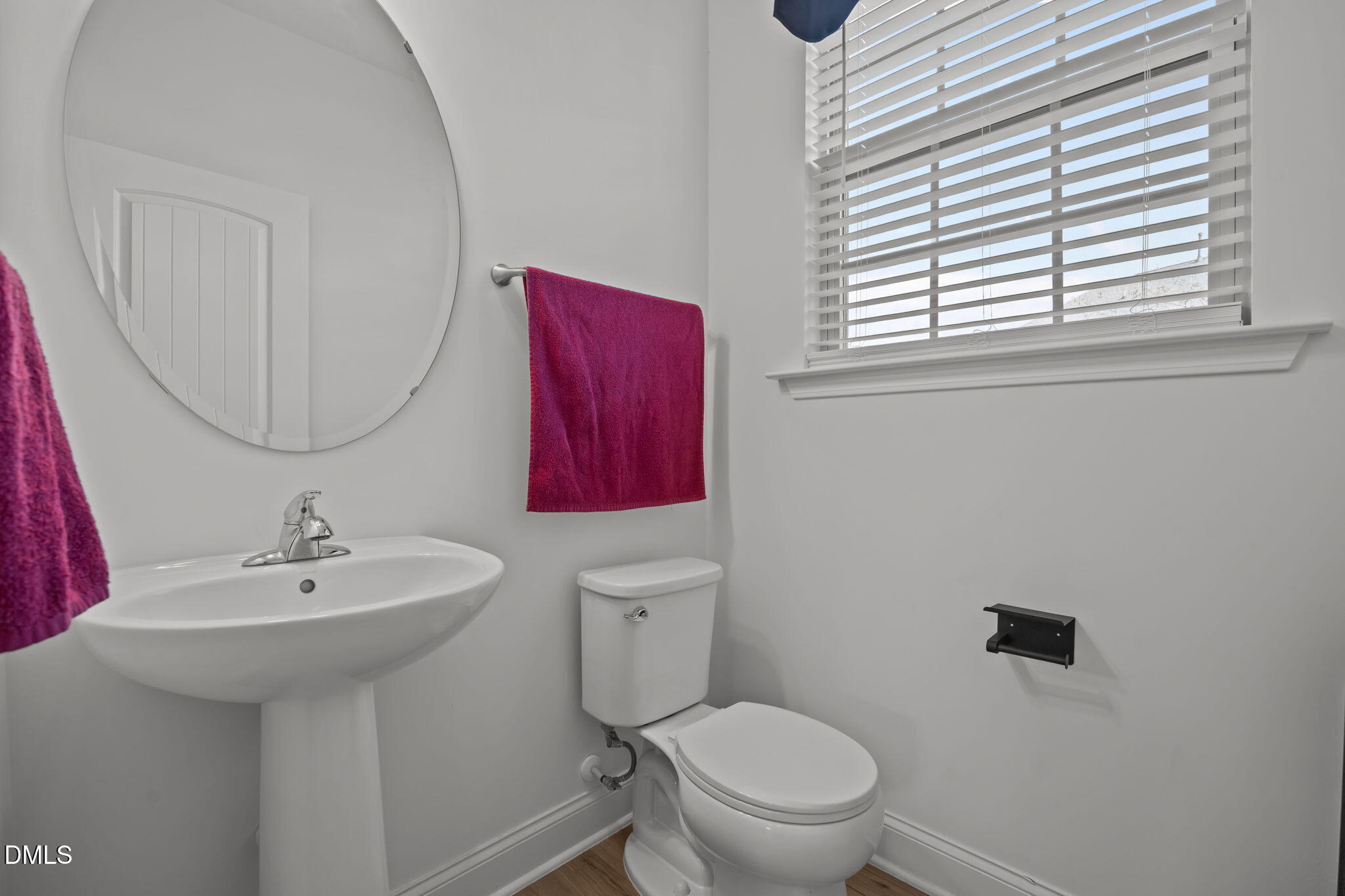 6173 Taylor Road Wendell, NC 27591 - Photo 12 of 31 a bathroom with a sink a toilet and a mirror