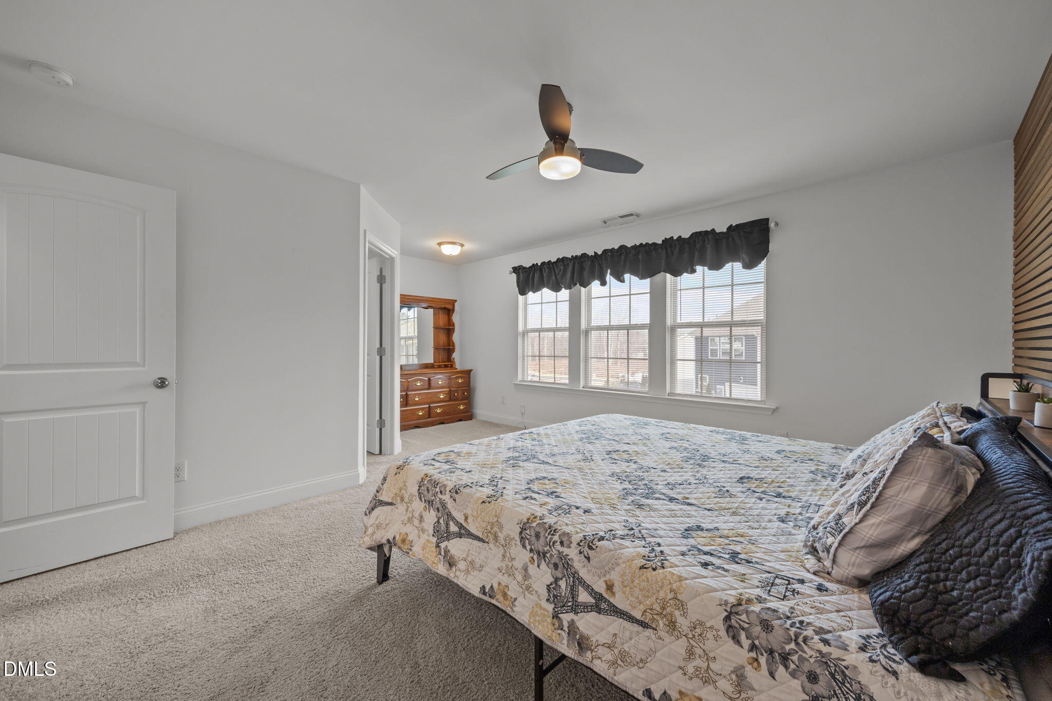 6173 Taylor Road Wendell, NC 27591 - Photo 14 of 31 a bedroom with a large bed and a window