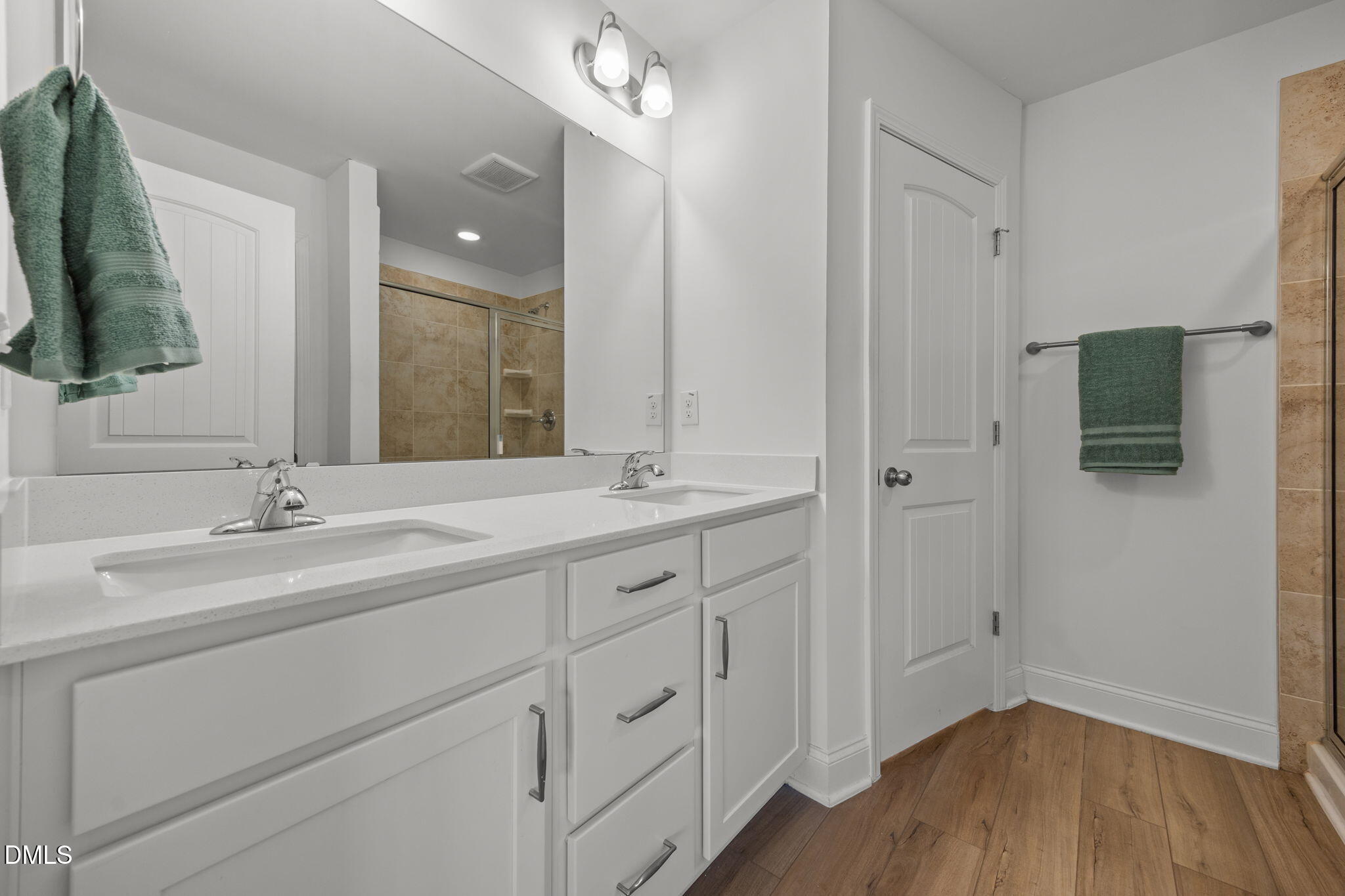 6173 Taylor Road Wendell, NC 27591 - Photo 16 of 31 a bathroom with a double vanity sink and mirror