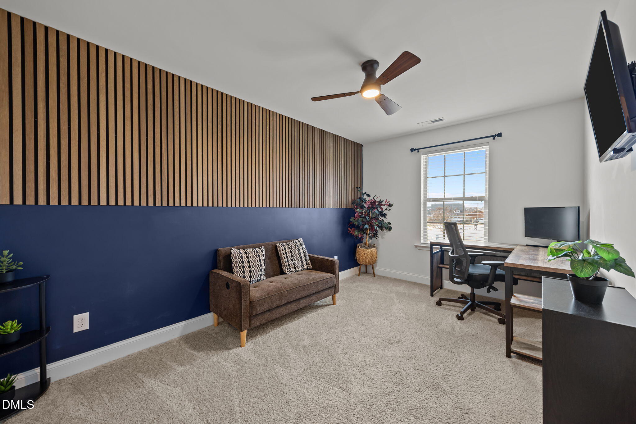 6173 Taylor Road Wendell, NC 27591 - Photo 19 of 31 a living room with furniture and a flat screen tv