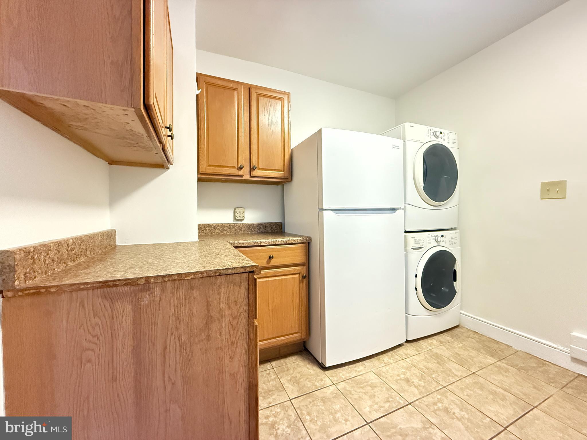 13701 Old Indian Head Road Brandywine, MD 20613 - Photo 13 of 18 a kitchen with a refrigerator a stove top oven and cabinets