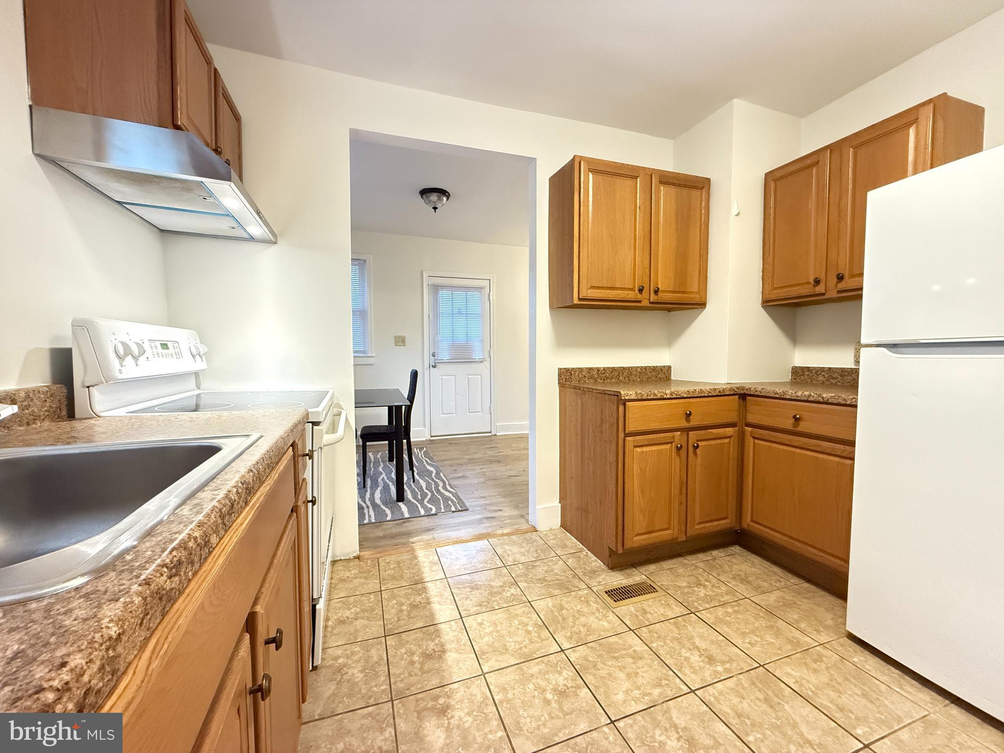 13701 Old Indian Head Road Brandywine, MD 20613 - Photo 14 of 18 a kitchen with a sink and a stove top oven