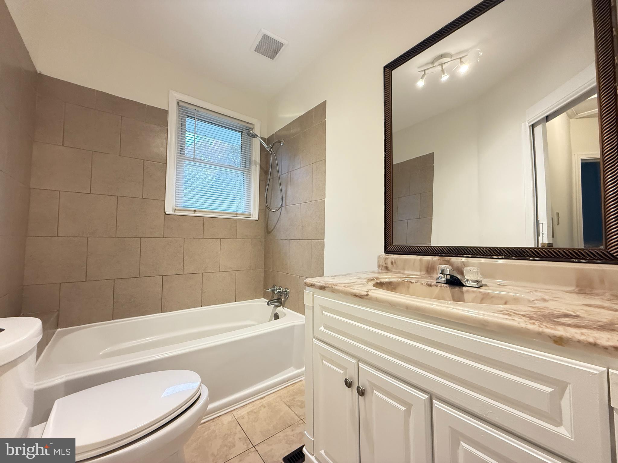 13701 Old Indian Head Road Brandywine, MD 20613 - Photo 16 of 18 a bathroom with a sink a toilet and bathtub