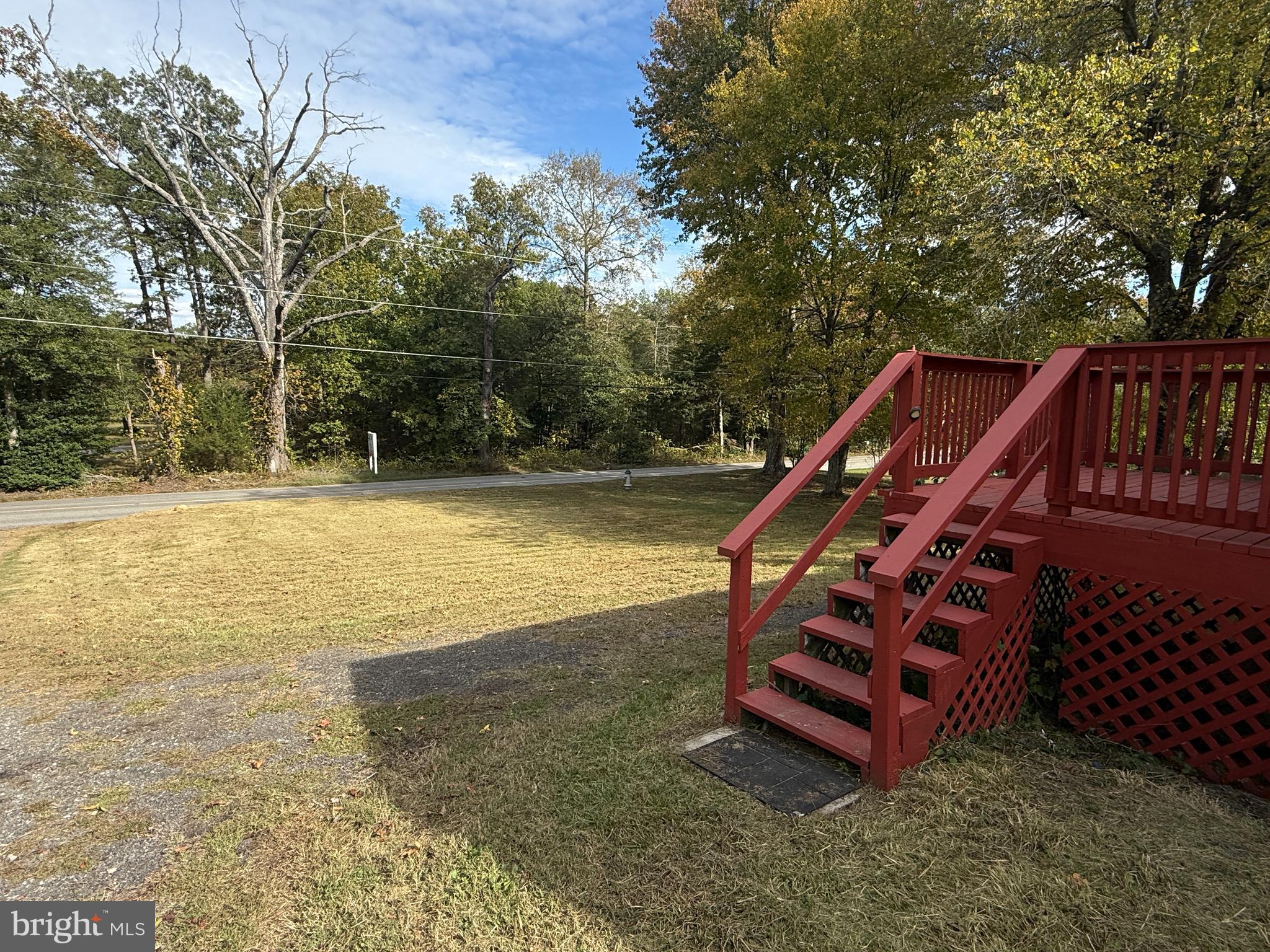 13701 Old Indian Head Road Brandywine, MD 20613 - Photo 18 of 18 a view of a swimming pool with chairs and wooden fence