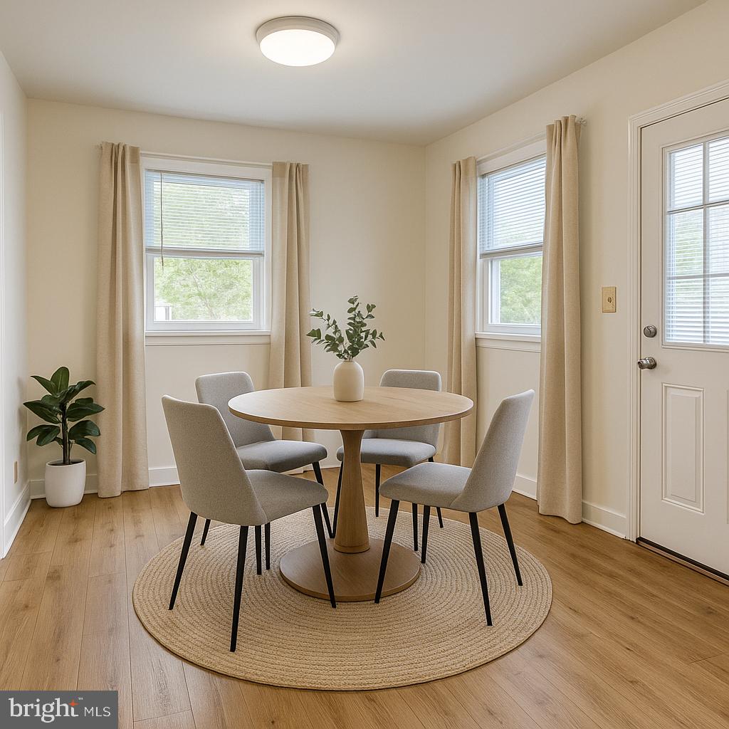13701 Old Indian Head Road Brandywine, MD 20613 - Photo 3 of 18 a dining room with furniture and wooden floor