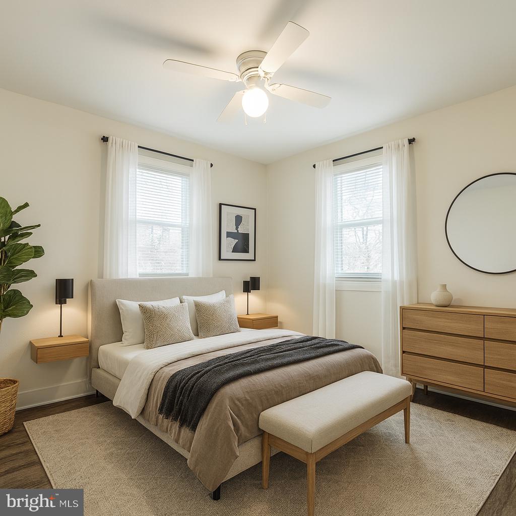 13701 Old Indian Head Road Brandywine, MD 20613 - Photo 6 of 18 a bedroom with a large bed and a chandelier