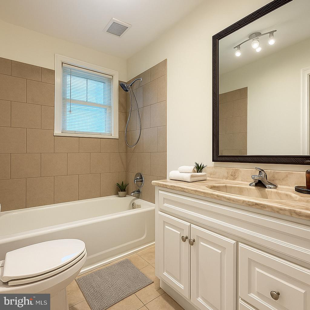 13701 Old Indian Head Road Brandywine, MD 20613 - Photo 8 of 18 a bathroom with a granite countertop sink mirror toilet and bathtub