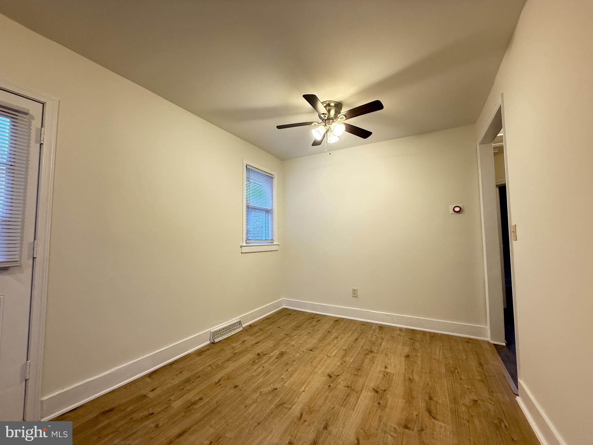 13701 Old Indian Head Road Brandywine, MD 20613 - Photo 9 of 18 a view of an empty room with wooden floor and a window
