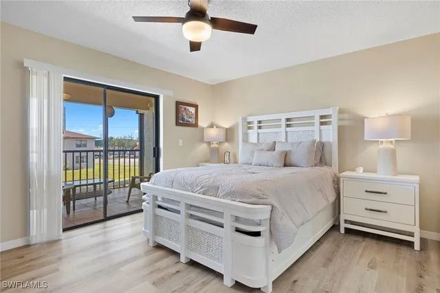 a bed room with a bed and a night stand