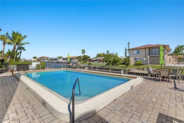 a view of a swimming pool with a terrace