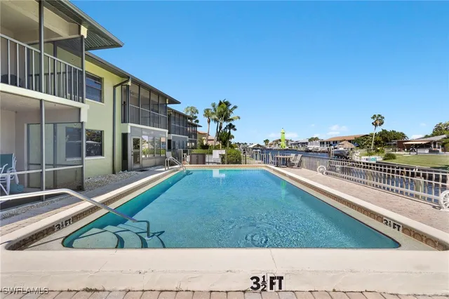 a view of a swimming pool with a lounge chairs