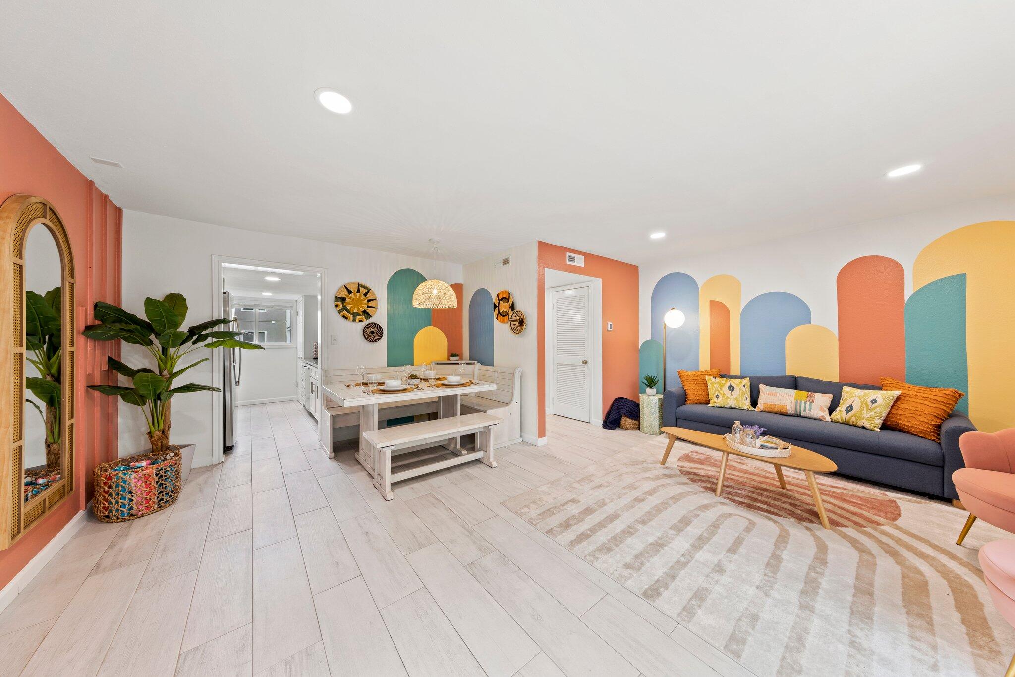 a living room with furniture and wooden floor