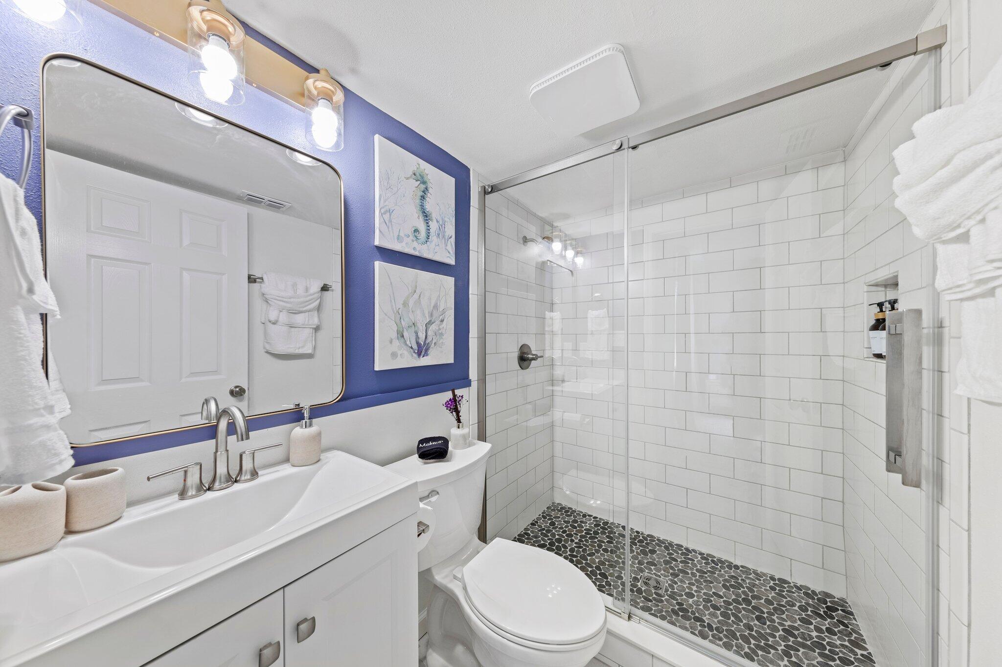 940 Highway 98, Unit 36 Destin, FL 32541 - Photo 15 of 31 a bathroom with a sink a toilet and shower