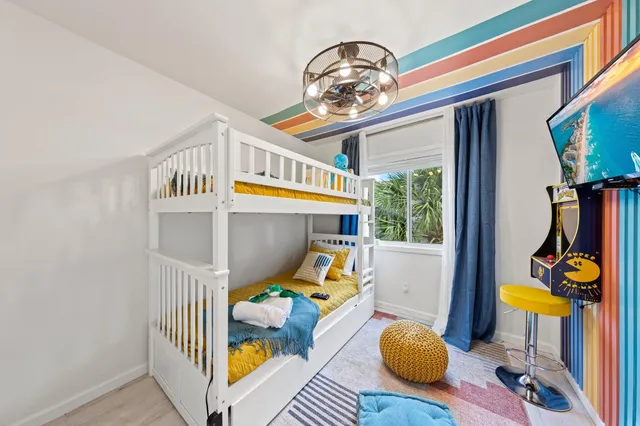 a view of living room filled with furniture and a chandelier
