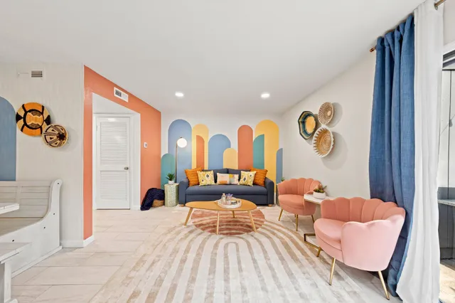 a bedroom with a bed and a couch