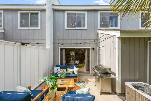 a living room filled with furniture and a table