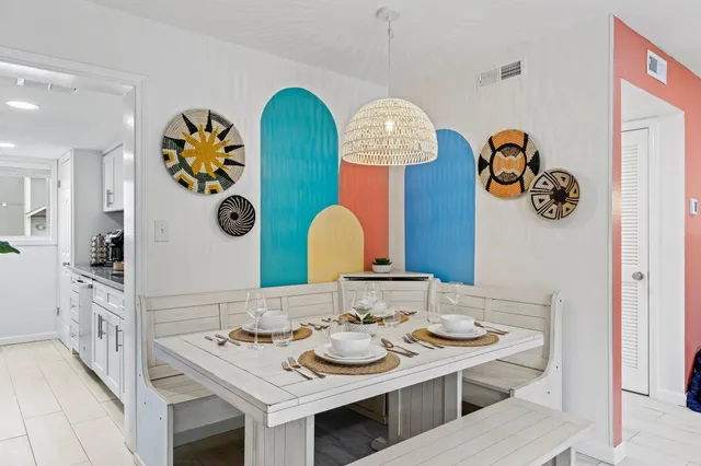 a bathroom with a sink mirror and vanity