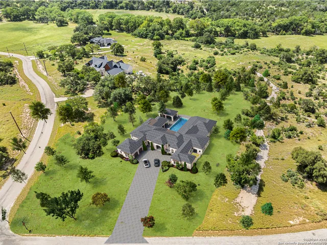 an aerial view of residential house with outdoor space