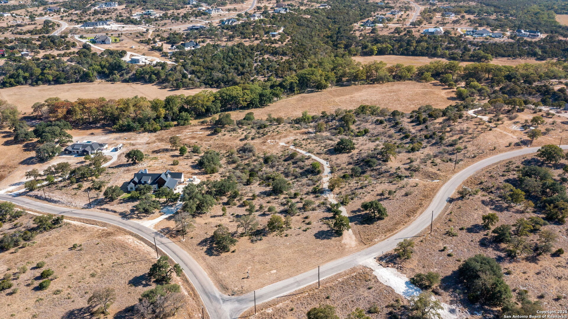 Lot 69 Sabinas Springs Road Boerne, TX 78006 - Photo 36 of 54 a view of a dry yard with wooden fence