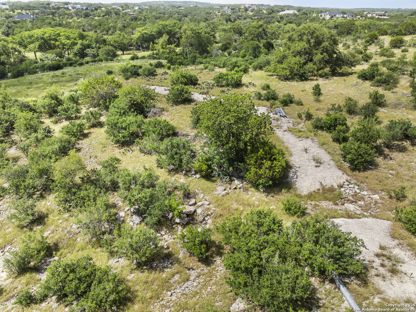 Lot 69 Sabinas Springs Road Boerne, TX 78006 - Photo 5 of 54 a view of a lush green forest with trees and houses