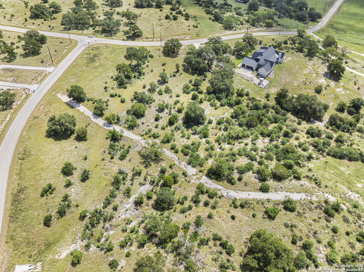 Lot 69 Sabinas Springs Road Boerne, TX 78006 - Photo 7 of 54 a view of a yard with a plants and tree