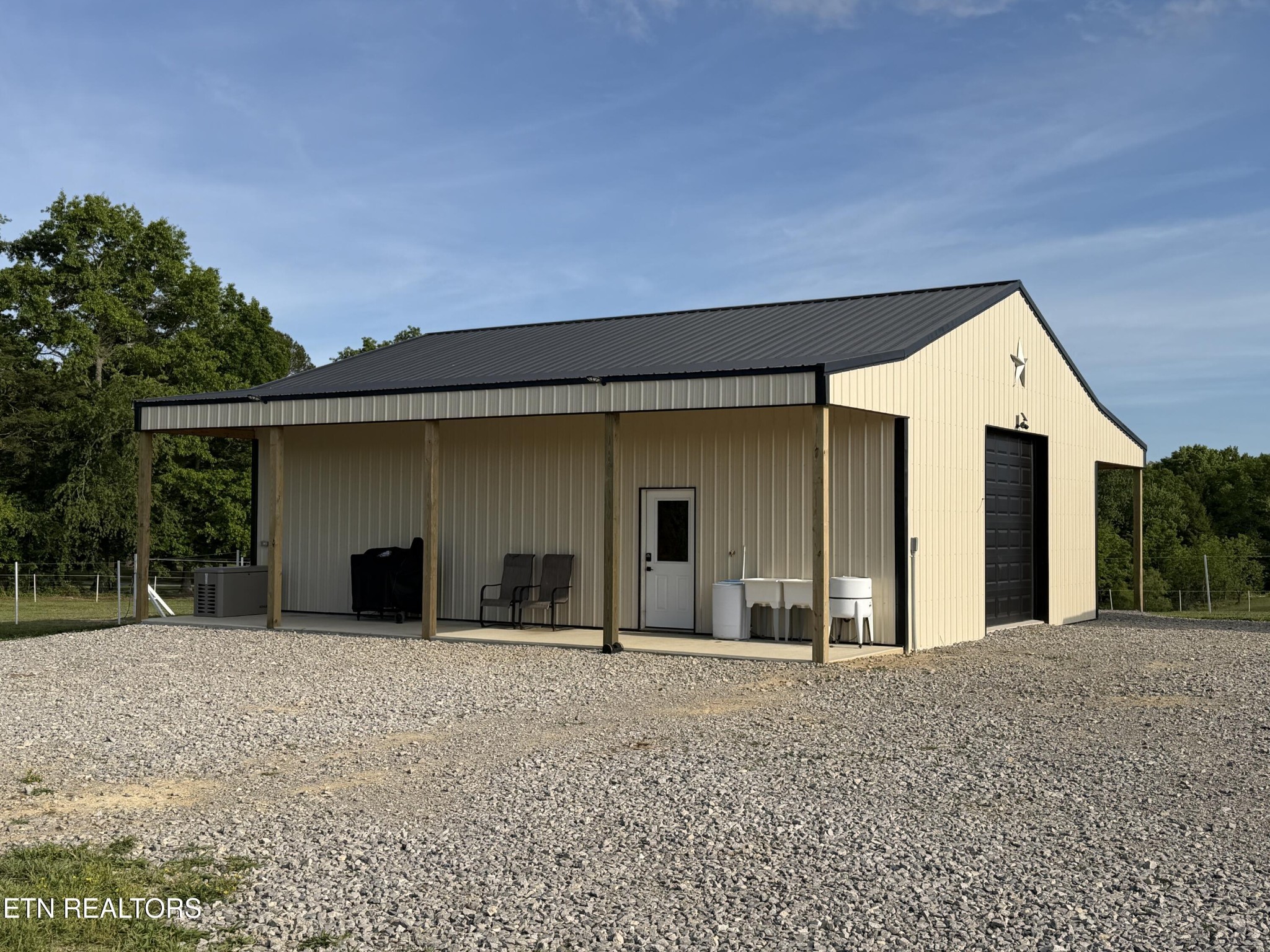 110 Don Conatser Road Allardt, TN 38504 - Photo 26 of 38 a front view of a house with a yard and garage