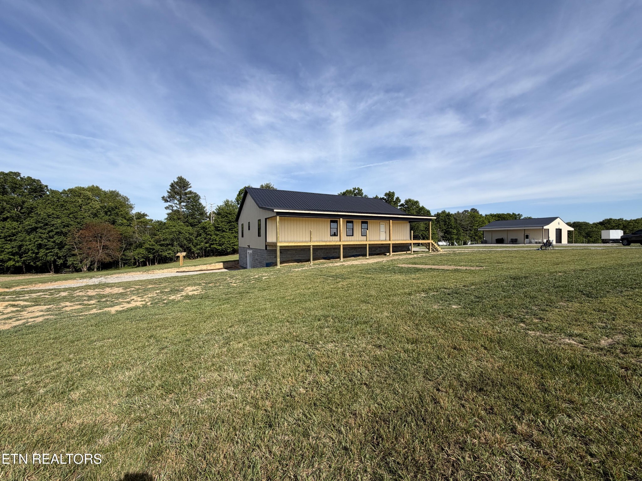 110 Don Conatser Road Allardt, TN 38504 - Photo 3 of 38 a front view of a house with a yard