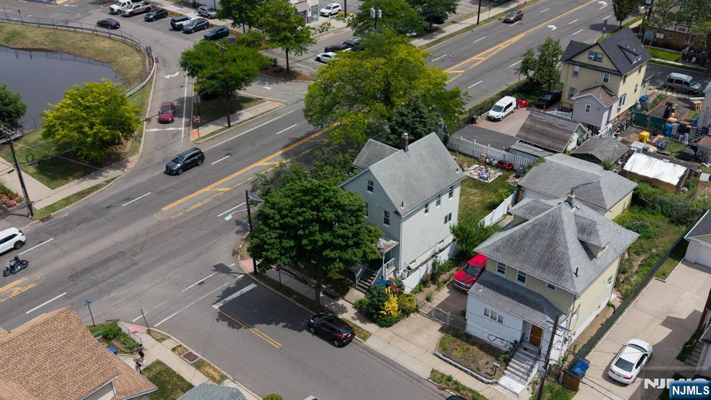 33-35 Pulaski Place Hackensack, NJ 07601 - Photo 3 of 32 an aerial view of a house with a yard and garden