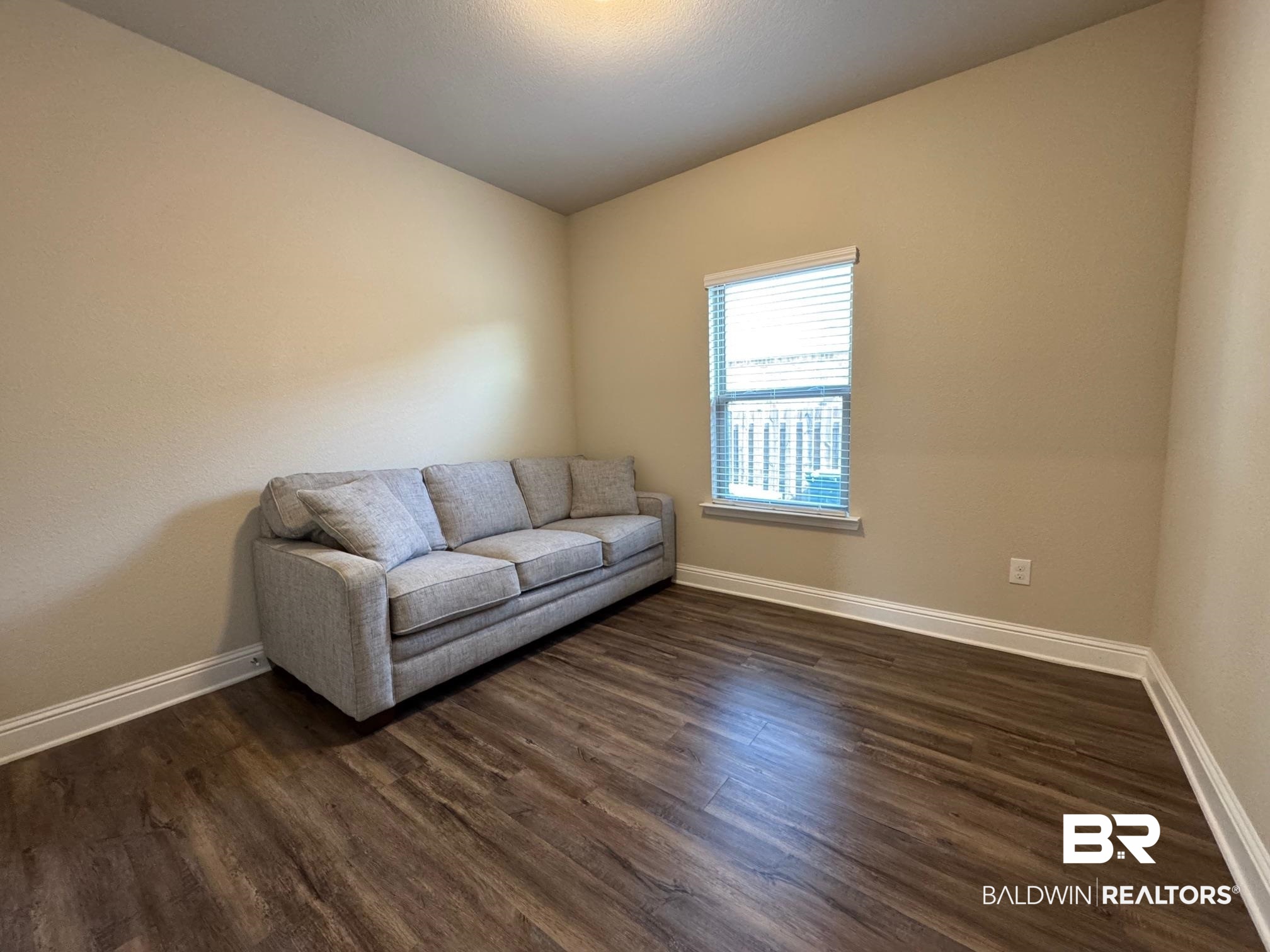 1346 Kairos Loop Foley, AL 36535 - Photo 24 of 40 Living room featuring dark hardwood / wood-style floors