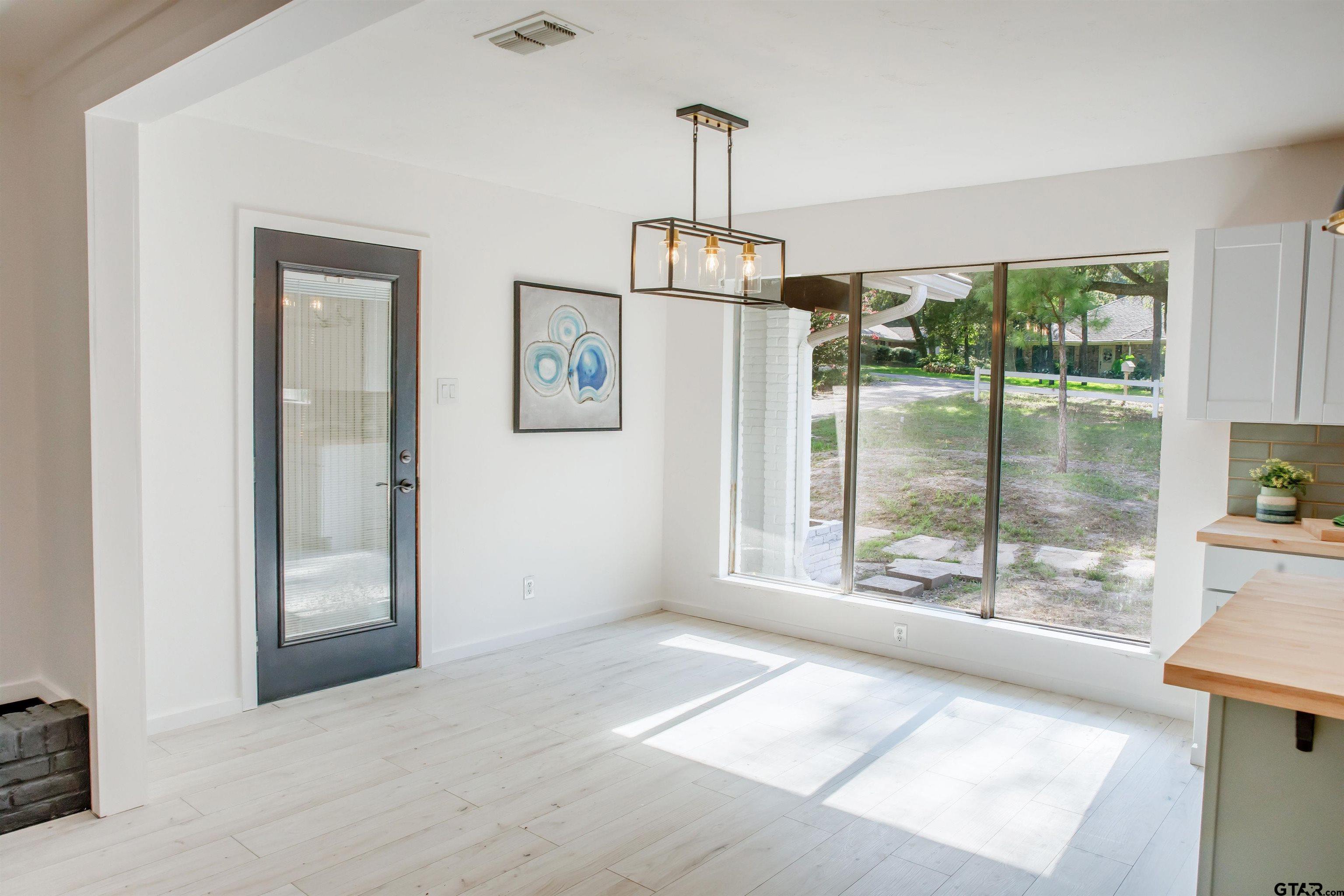 439 Lone Star Lane Hideaway, TX 75771 - Photo 17 of 36 a view of livingroom with furniture wooden floor and window
