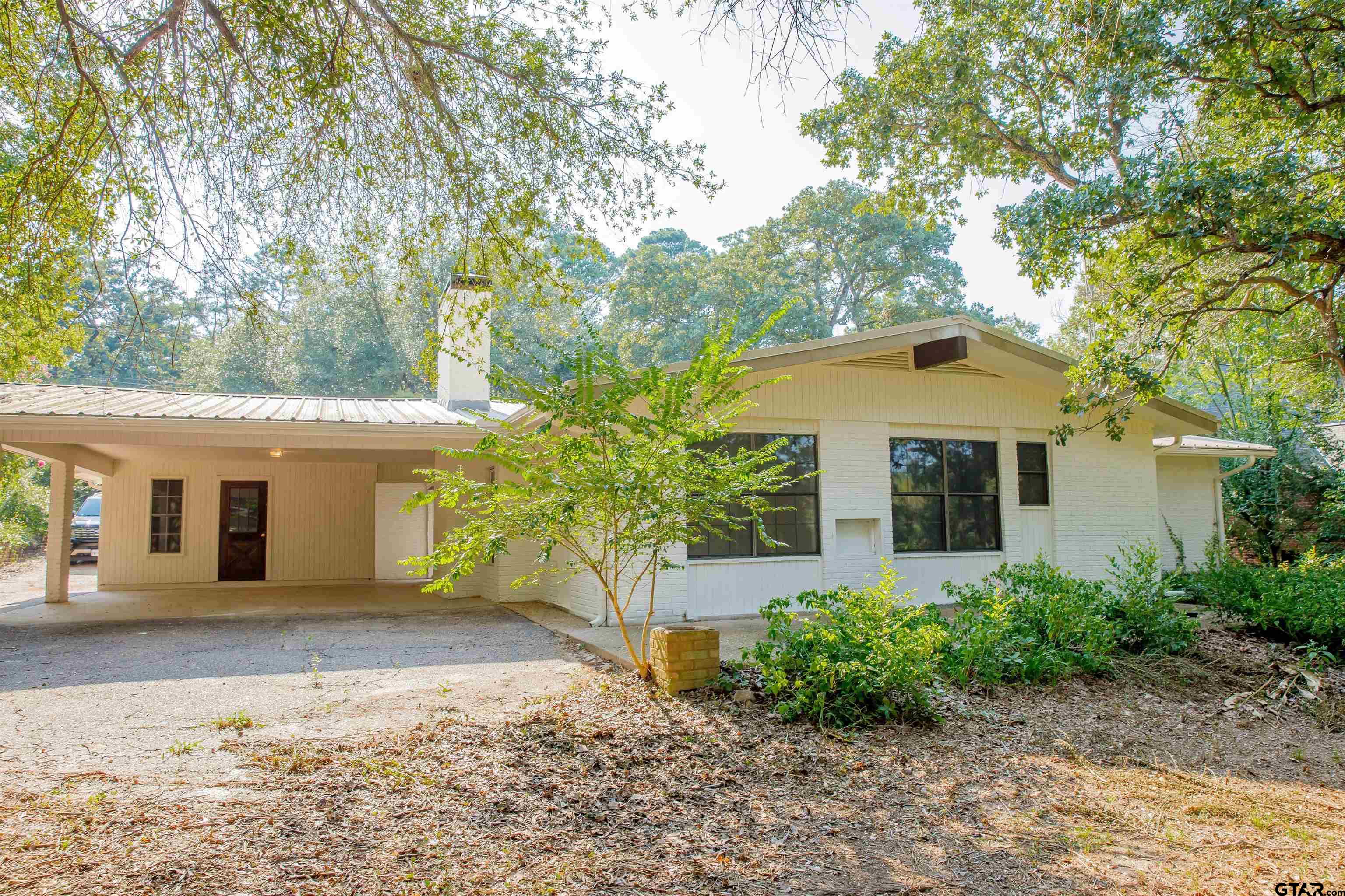 439 Lone Star Lane Hideaway, TX 75771 - Photo 5 of 36 front view of a house with a yard